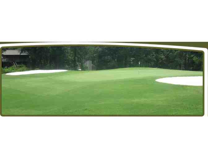 A foursome with carts at Fairfield Plantation Golf Club.