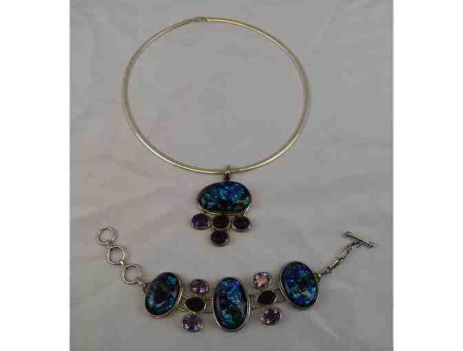 Sterling silver necklace, pendent with matching bracelet with black and blue precious stones.