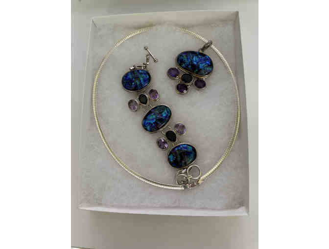 Sterling silver necklace, pendent with matching bracelet with black and blue precious stones.