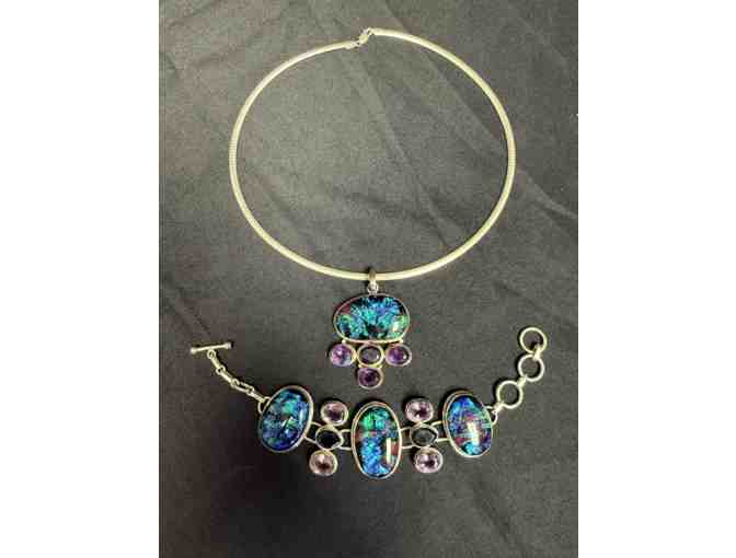 Sterling silver necklace, pendent with matching bracelet with black and blue precious stones.