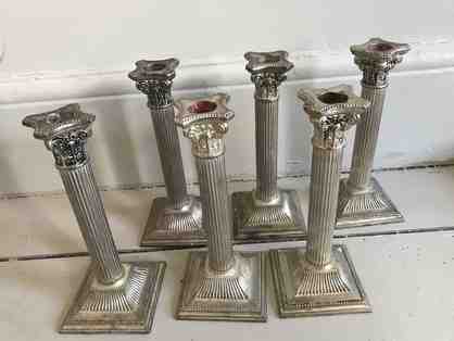 Set of six ornate candle sticks