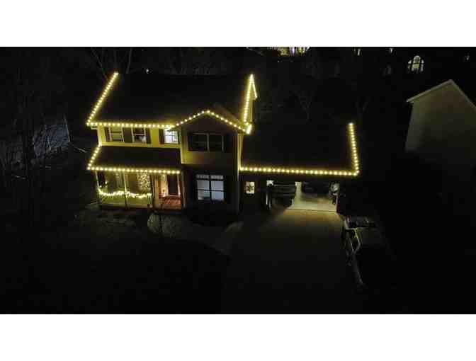 100 feet of Christmas lights installed and taken down - LIVE AUCTION ITEM