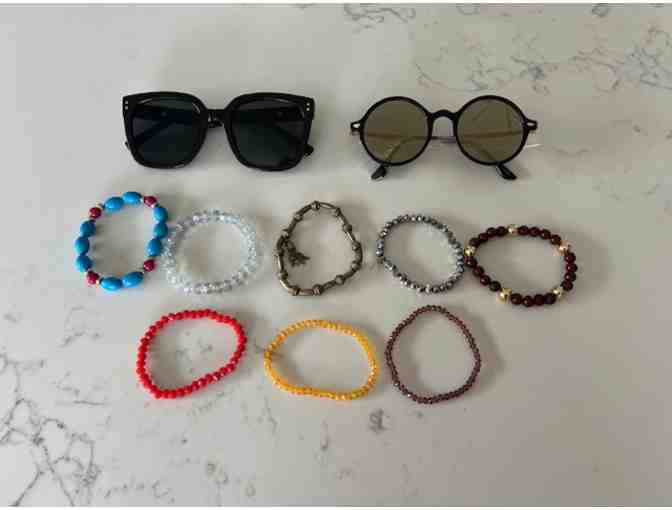 2 pairs of sunglasses and 8 bracelets from Fourth Dimension Clothing Boutique