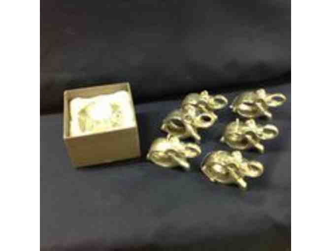 Metal elephant napkin rings and a Rosenthal crystal votive candle holder
