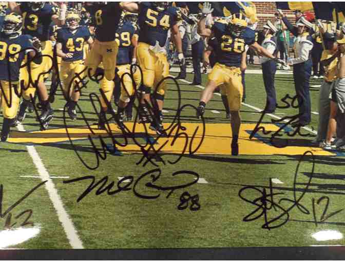 Larry Foote, Anthony Thomas, Aaron Shea. Eight Lloyd Carr era Wolverines signed this photo