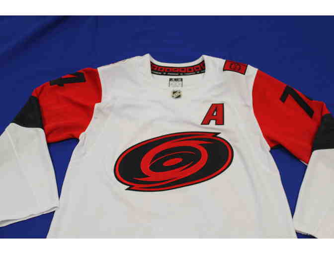 Jaccob Slavin Autographed Jersey and Game Used Stick