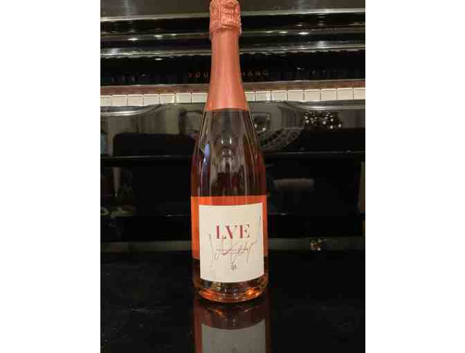 Bottle of LVE French Sparkling Rose signed by John Legend
