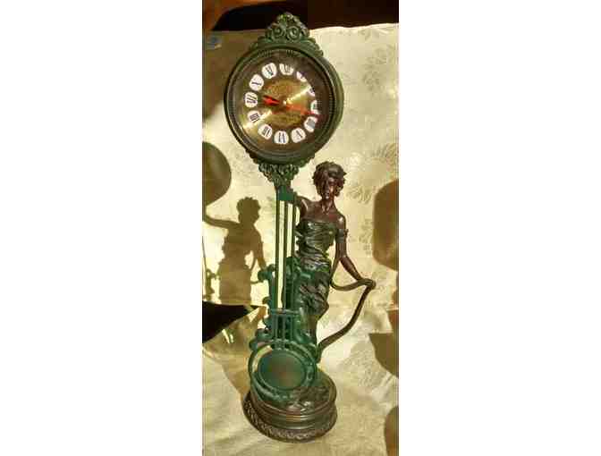 Charming working statuary clock