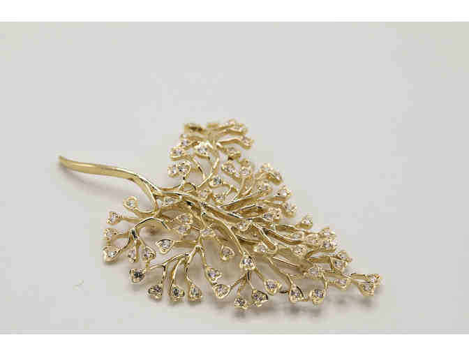 14K gold and diamond pin in the shape of a tree branch